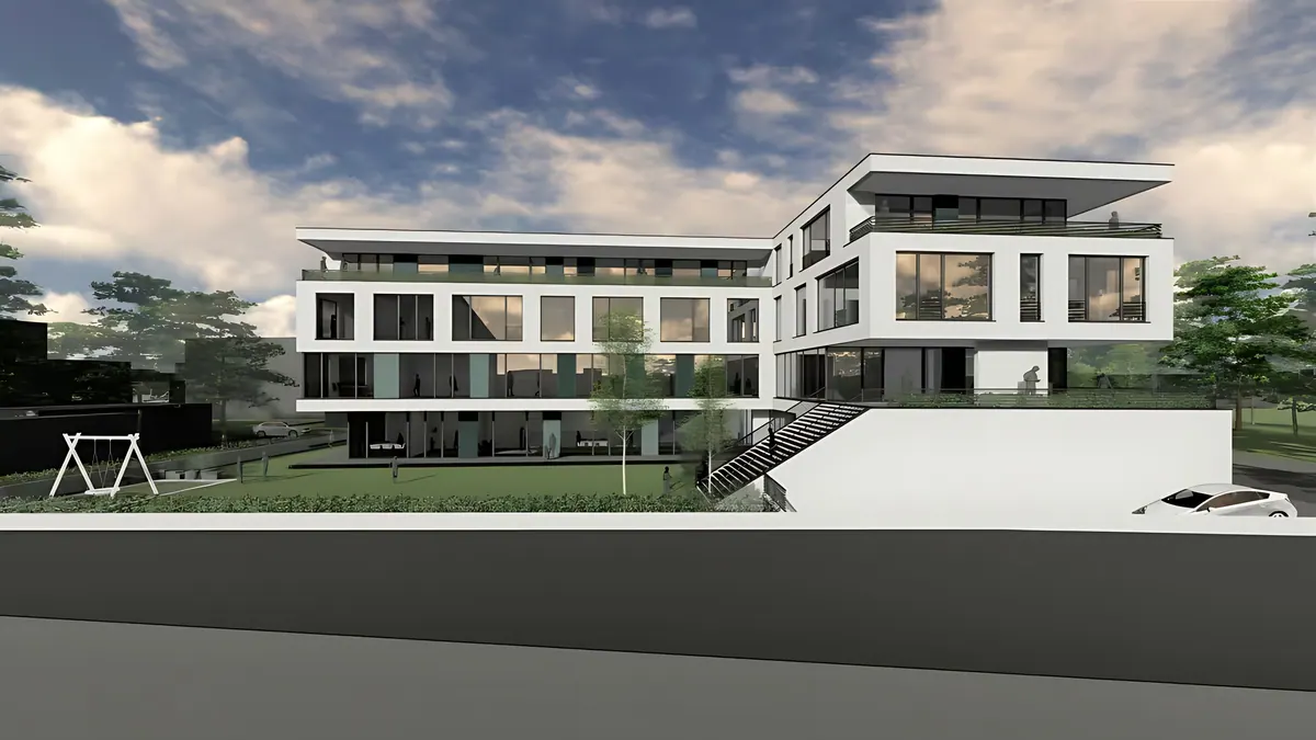 Side view with a lawn and the set-back top floor